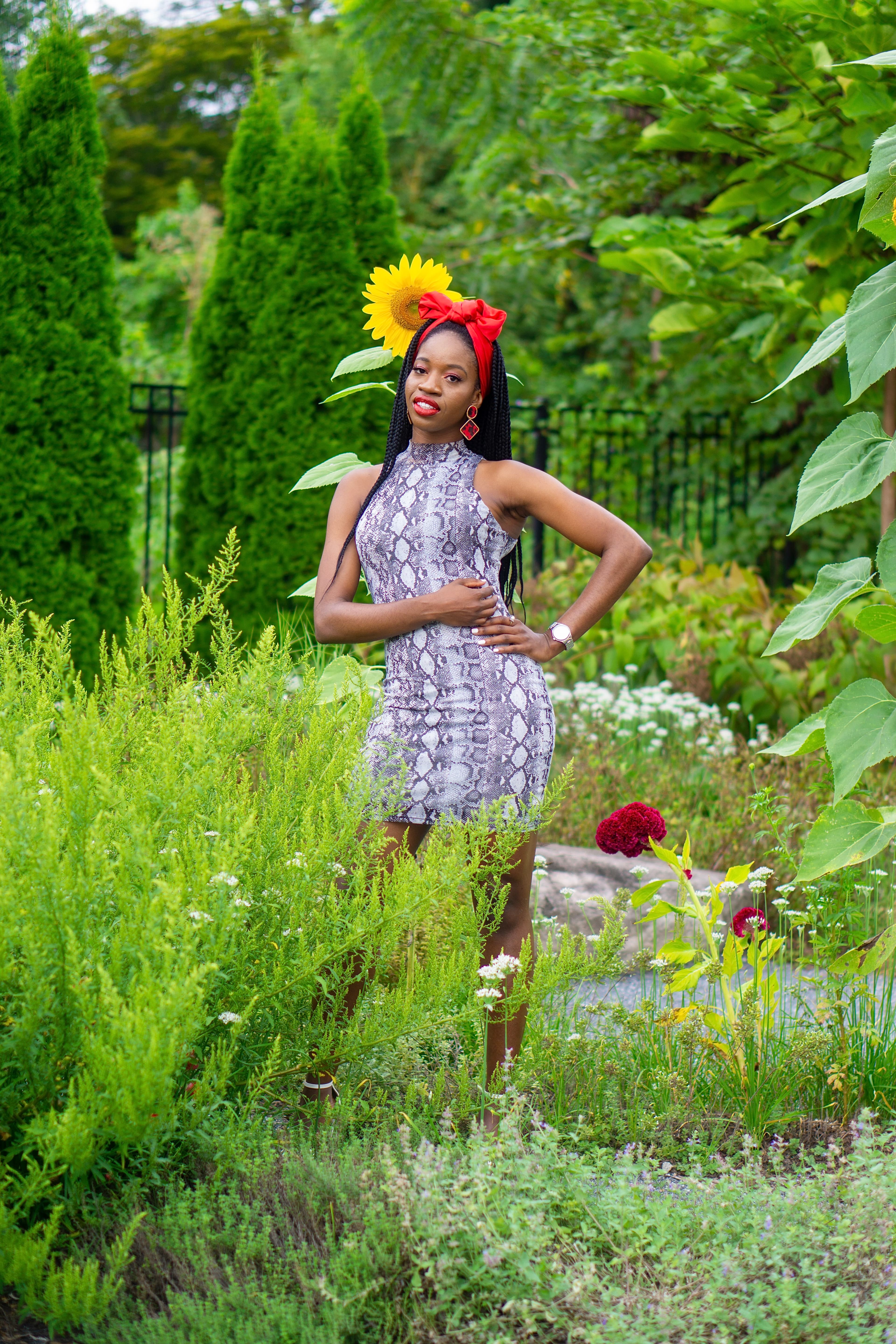 Lifestyle portrait, woman in garden with sunflower crown