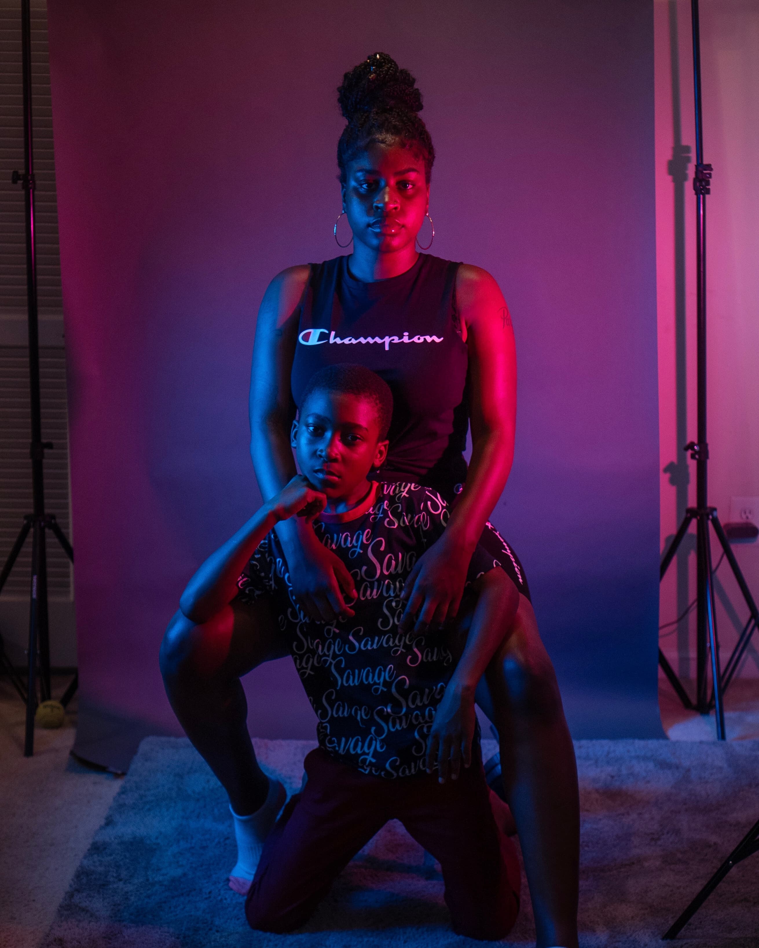 Neon family portrait, mother and son, wide frame