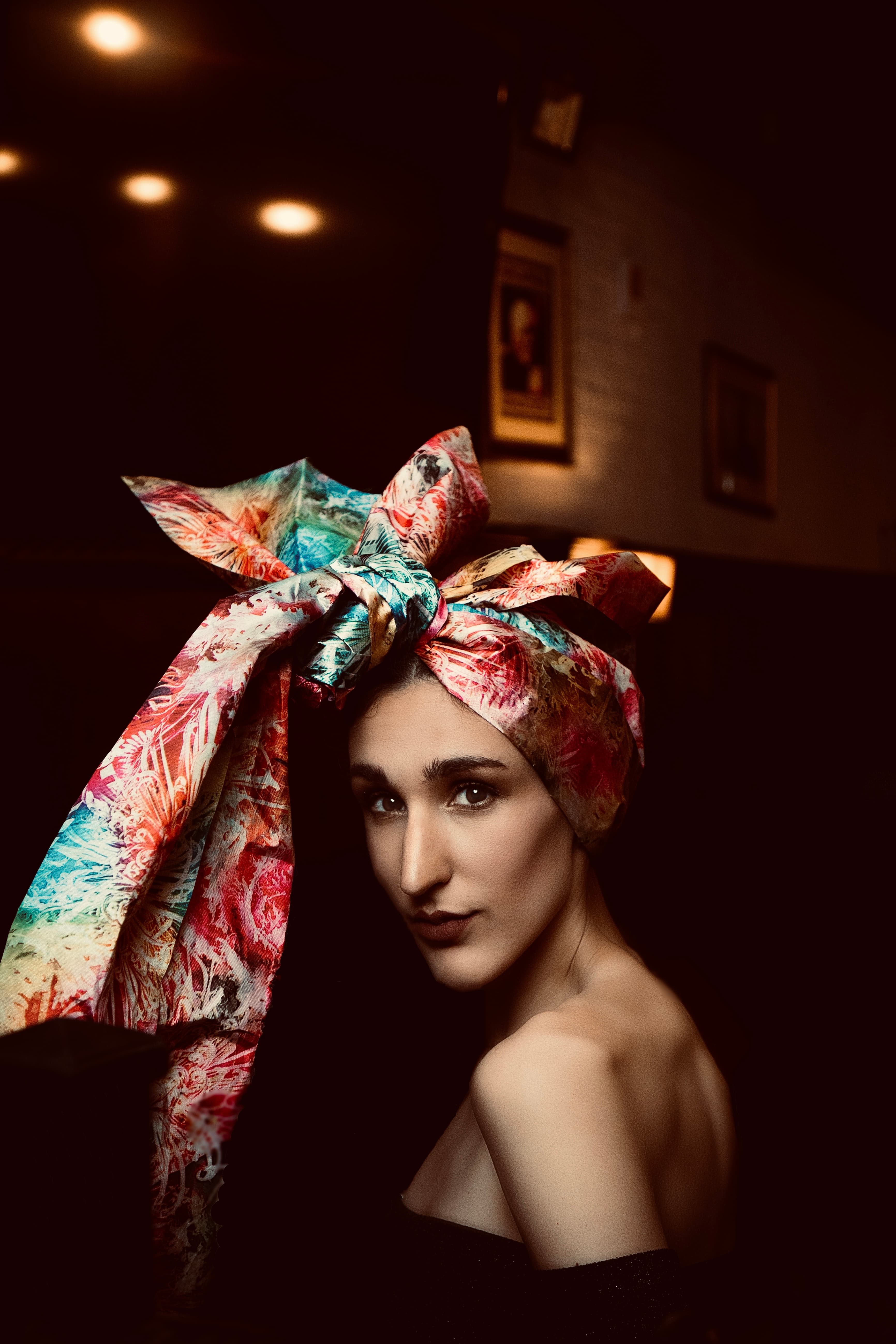 Editorial portrait, woman with colorful silk headwrap