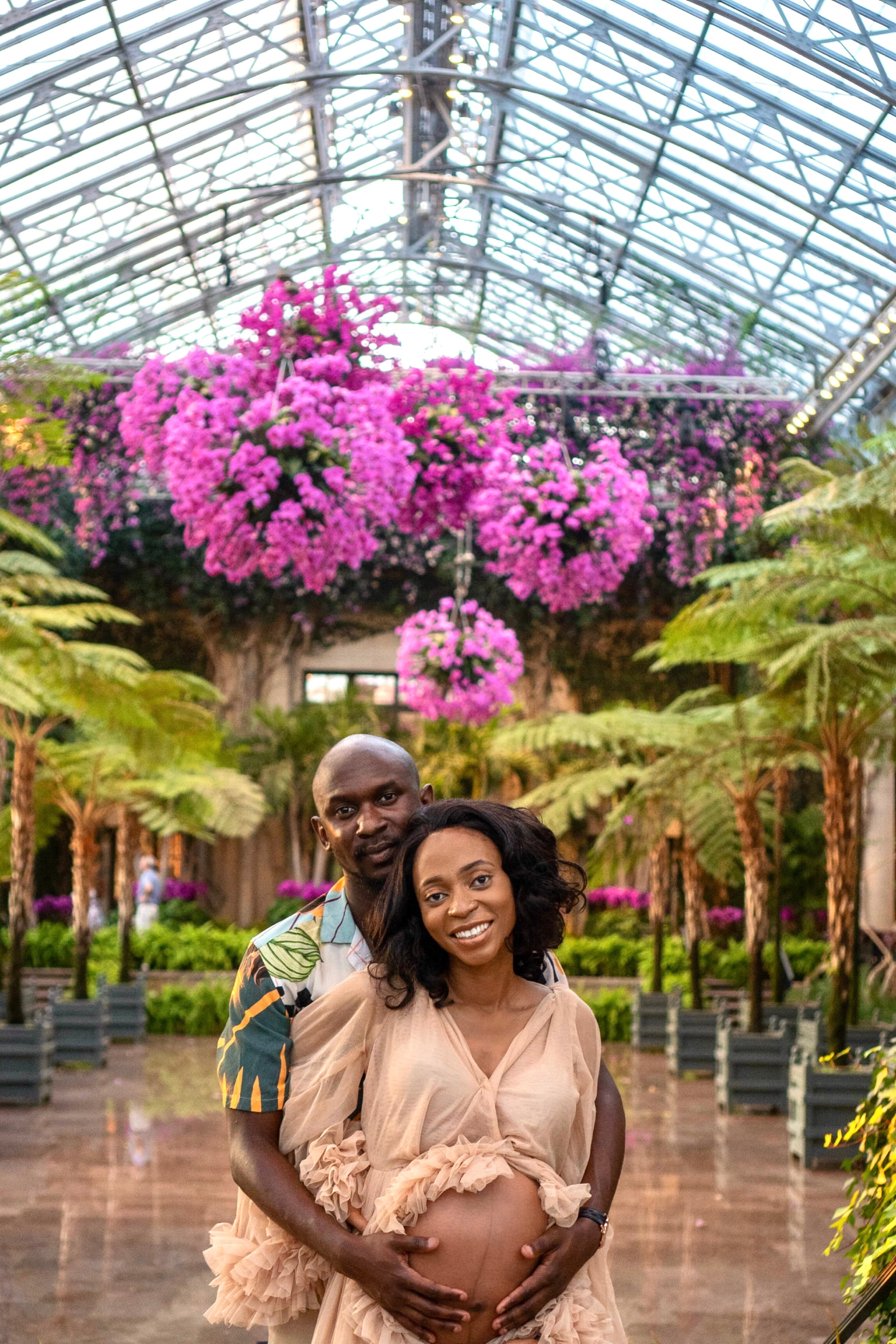 Maternity couple portrait, botanical greenhouse, blush gown