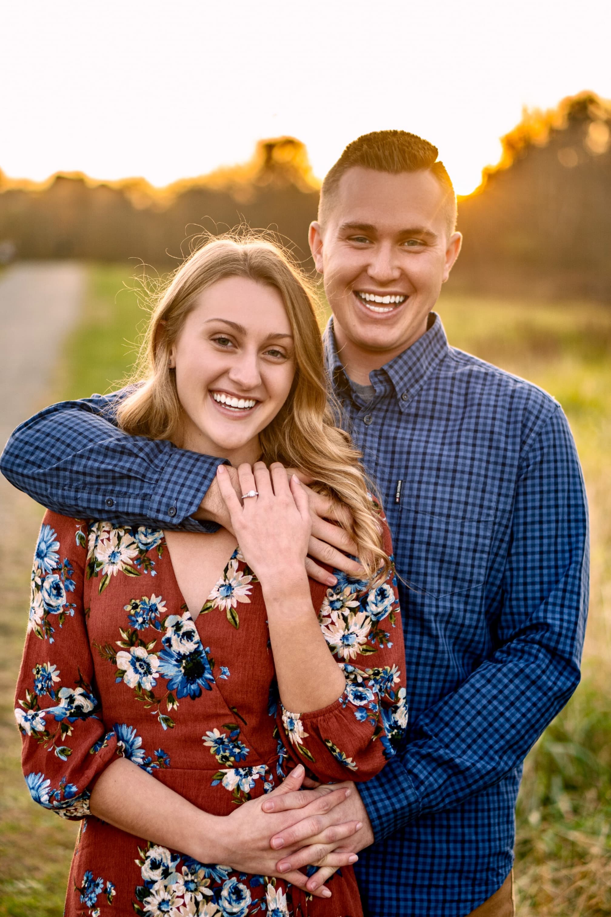 Couple portrait, golden hour in open field
